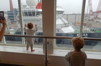 Kids playing on board with a view on the port