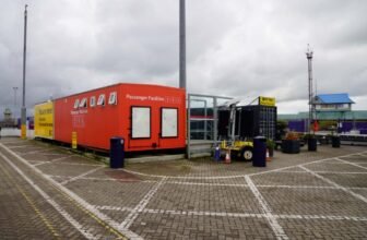 Containers serving as toilets and a shop.